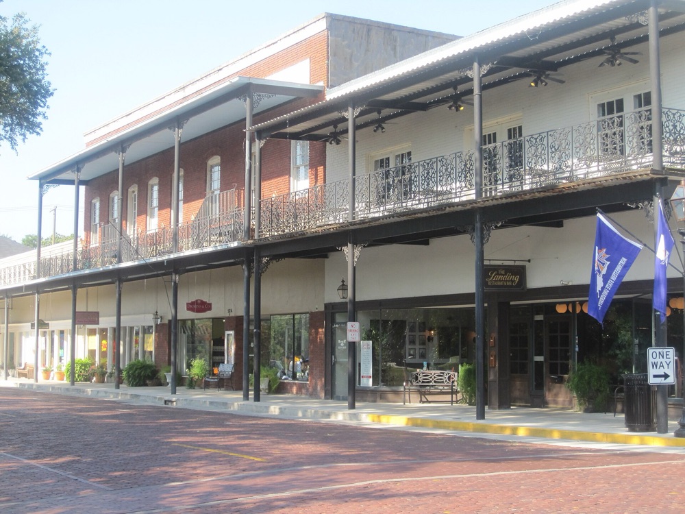 Brick street and balconied buildings in downtown Natchitoches